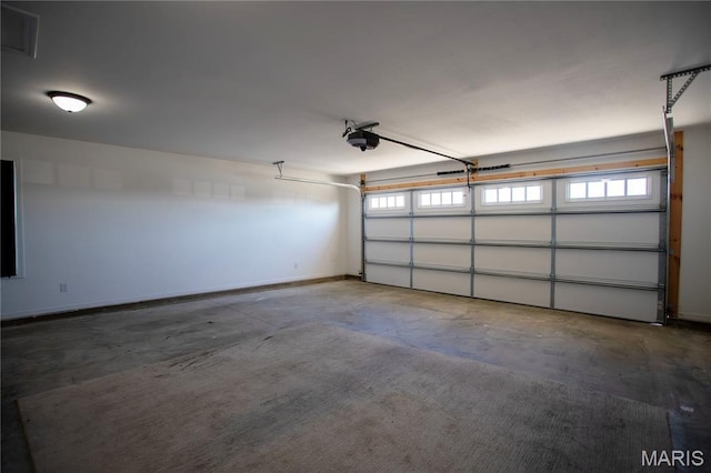 1205 Yosemite, Sikeston, MO 63801 - garage featuring a garage door opener and baseboards
