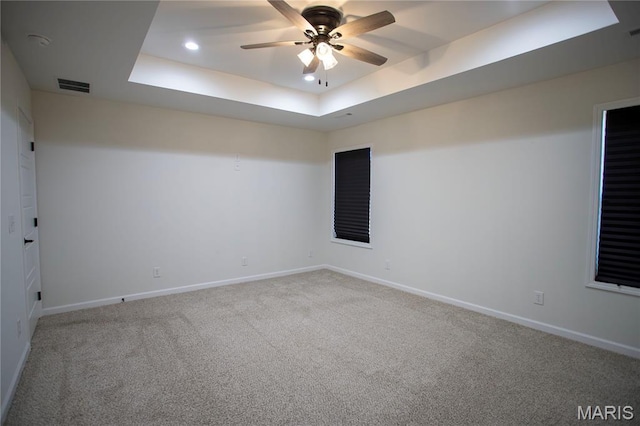 1205 Yosemite, Sikeston, MO 63801 - carpeted spare room featuring a tray ceiling, ceiling fan, and recessed lighting