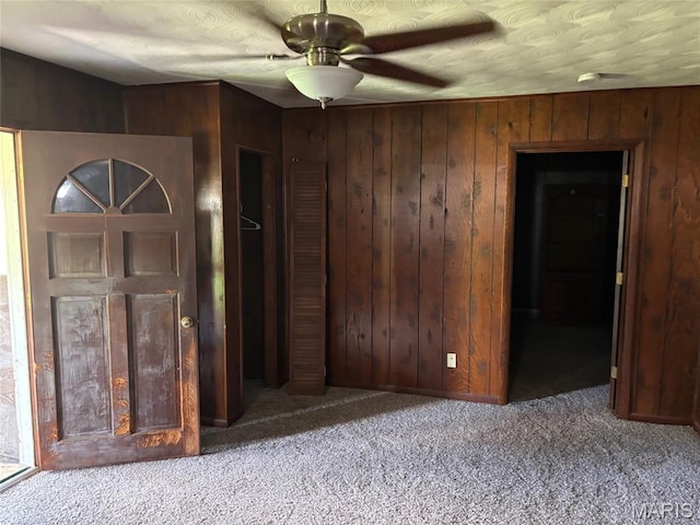 304 Taylor Ave, Park Hills, MO 63601 - carpeted spare room featuring a ceiling fan and wooden walls