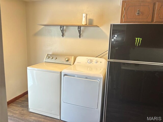 304 Taylor Ave, Park Hills, MO 63601 - laundry area with washing machine and dryer, wood finished floors, and cabinet space