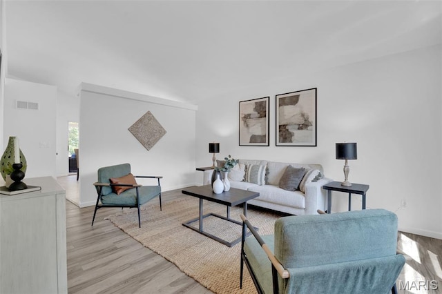 427 Xavier Ct, Valley Park, MO 63088 - living room with light wood-style flooring and baseboards