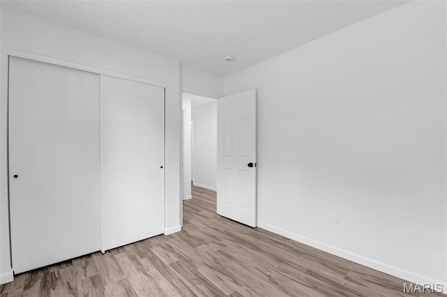 427 Xavier Ct, Valley Park, MO 63088 - unfurnished bedroom with wood finished floors and a closet