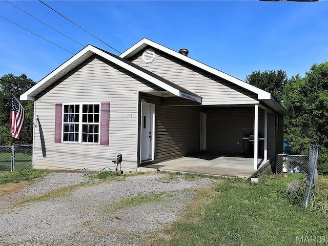 1315 S 11th St, Poplar Bluff, MO 63901 - single story home with driveway, a patio area, and a carport