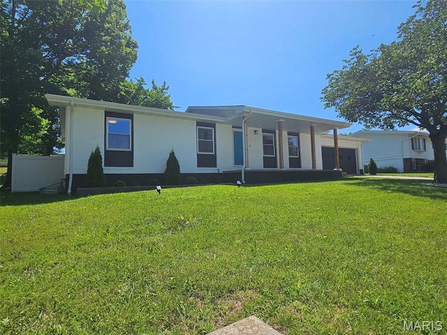 23 Hamlin Heights Dr, Hannibal, MO 63401 - manufactured / mobile home with an attached garage, a front lawn, and stucco siding