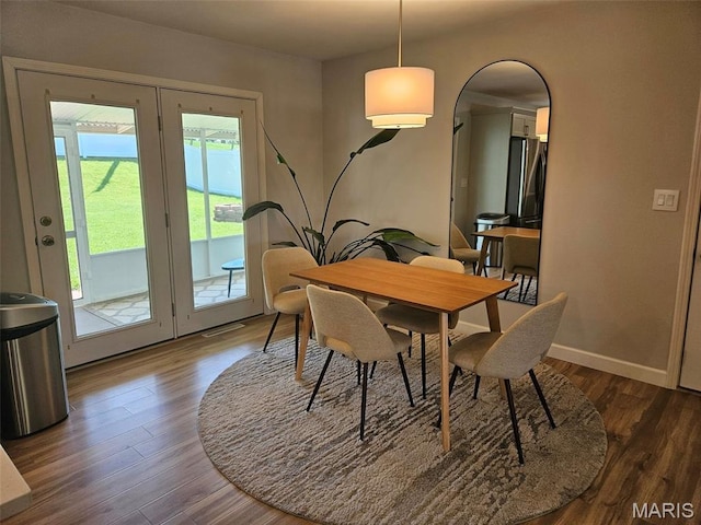23 Hamlin Heights Dr, Hannibal, MO 63401 - dining room featuring dark wood finished floors and arched walkways