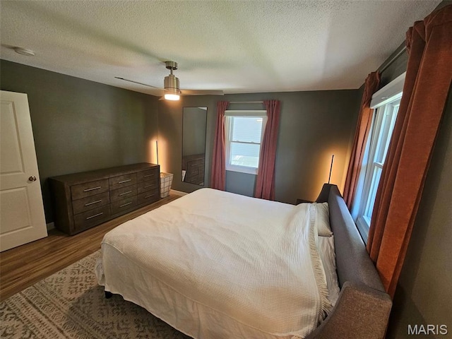 23 Hamlin Heights Dr, Hannibal, MO 63401 - bedroom with wood finished floors, a textured ceiling, and ceiling fan