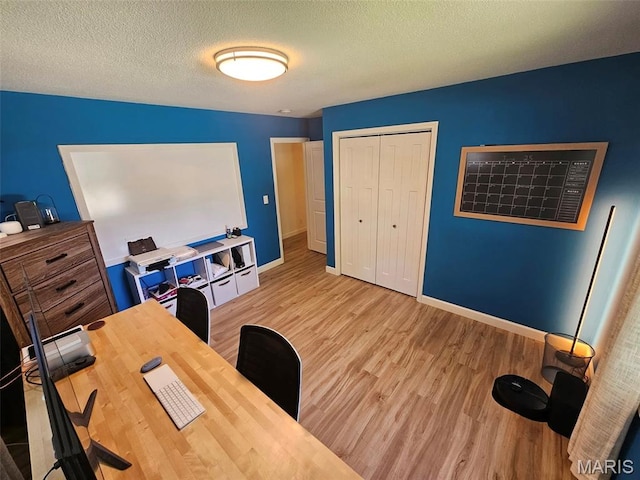 23 Hamlin Heights Dr, Hannibal, MO 63401 - home office with light wood-style floors and a textured ceiling
