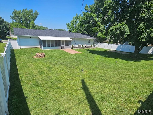 23 Hamlin Heights Dr, Hannibal, MO 63401 - rear view of house with a sunroom, a fenced backyard, and a patio