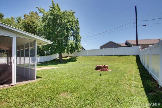 23 Hamlin Heights Dr, Hannibal, MO 63401 - fenced backyard with a sunroom and an outdoor fire pit