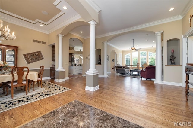 204 Logans Ct, Foristell, MO 63348 - foyer with wood finished floors, ceiling fan, crown molding, arched walkways, and recessed lighting