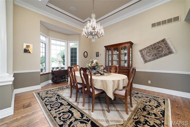 204 Logans Ct, Foristell, MO 63348 - dining room with a chandelier, wood finished floors, and ornamental molding