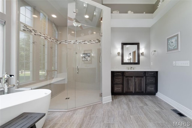 204 Logans Ct, Foristell, MO 63348 - full bathroom featuring vanity, a freestanding bath, a stall shower, a ceiling fan, and recessed lighting