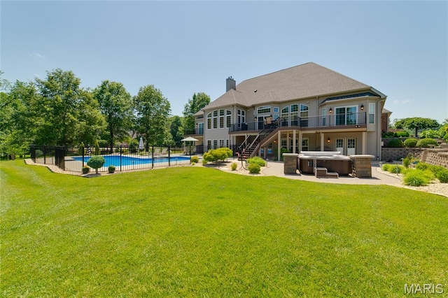 204 Logans Ct, Foristell, MO 63348 - rear view of property with a hot tub, a patio, a chimney, and a wooden deck