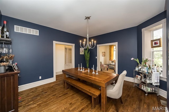 3822 Humphrey St, Saint Louis, MO 63116 - dining space with a chandelier and wood finished floors