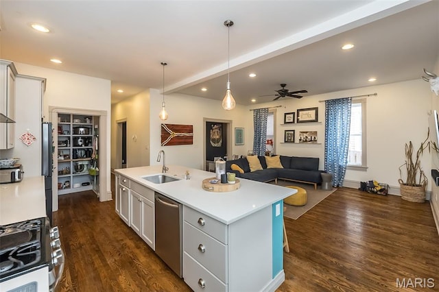 3822 Humphrey St, Saint Louis, MO 63116 - kitchen featuring stainless steel appliances, dark wood-style flooring, ceiling fan, a kitchen island with sink, and recessed lighting