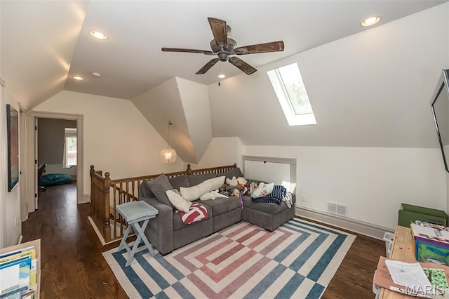 3822 Humphrey St, Saint Louis, MO 63116 - living room with ceiling fan, a skylight, vaulted ceiling, wood finished floors, and recessed lighting