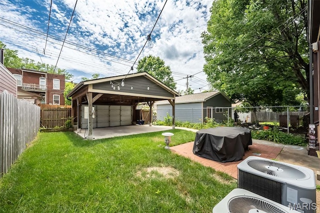 3822 Humphrey St, Saint Louis, MO 63116 - fenced backyard featuring a detached garage and an outdoor structure