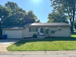 273 Buddie Ave, Saint Louis, MO 63135 - ranch-style house featuring a front yard, an attached garage, and driveway