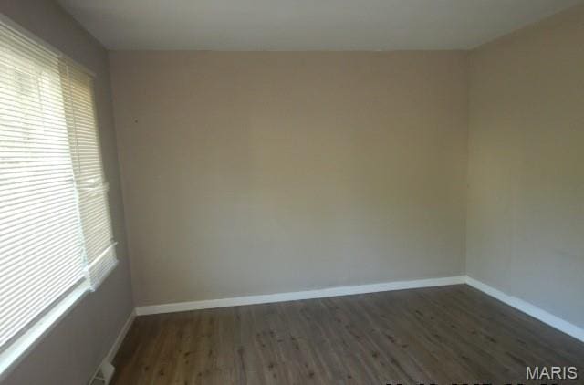 273 Buddie Ave, Saint Louis, MO 63135 - unfurnished room featuring dark wood-style flooring and baseboards