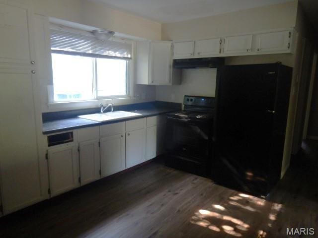 273 Buddie Ave, Saint Louis, MO 63135 - kitchen featuring black appliances, white cabinets, dark wood finished floors, and exhaust hood