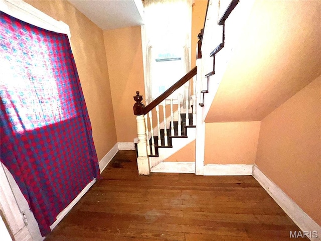 1112 Center St, Bismarck, MO 63624 - staircase with hardwood / wood-style flooring and baseboards