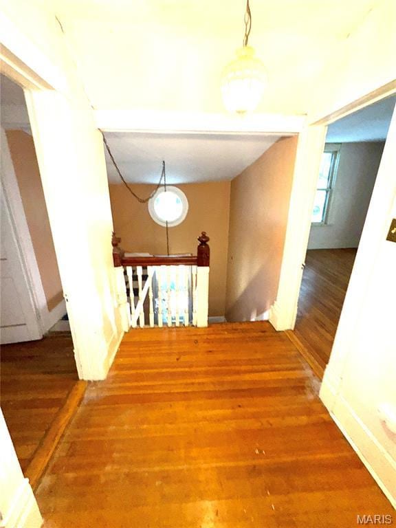1112 Center St, Bismarck, MO 63624 - corridor with wood finished floors and an upstairs landing