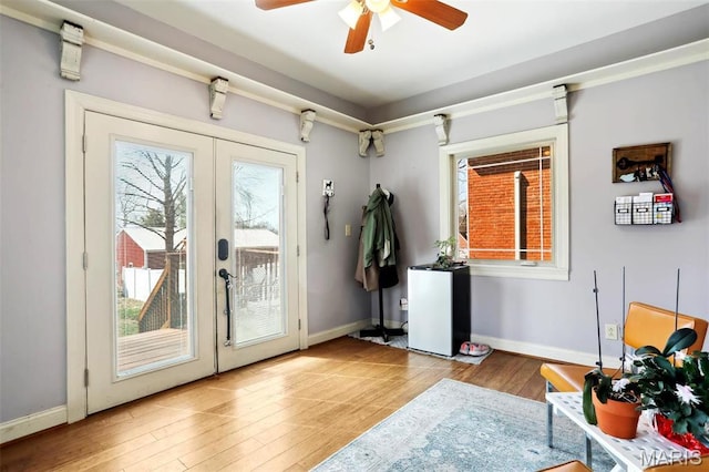 502 W 5th St, Washington, MO 63090 - doorway to outside featuring french doors, a ceiling fan, and wood finished floors