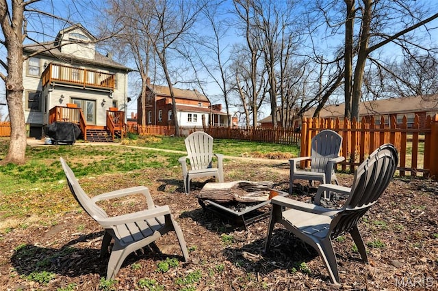 502 W 5th St, Washington, MO 63090 - fenced backyard featuring a fire pit, a deck, and a balcony