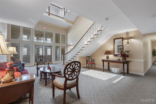 208 Ambridge Ct Unit 302, Chesterfield, MO 63017 - carpeted living room with stairs and a towering ceiling