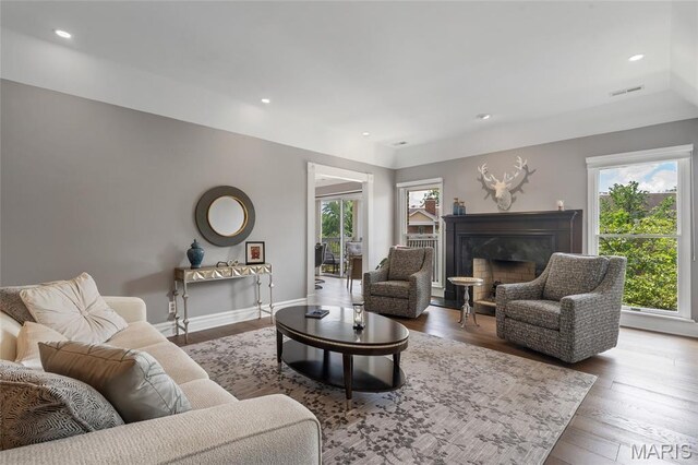 208 Ambridge Ct Unit 302, Chesterfield, MO 63017 - living room featuring plenty of natural light, a high end fireplace, wood finished floors, and recessed lighting
