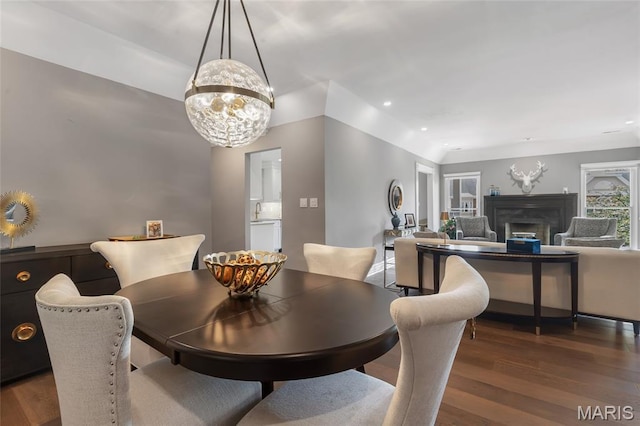 208 Ambridge Ct Unit 302, Chesterfield, MO 63017 - dining room featuring wood finished floors, a fireplace, a chandelier, and recessed lighting