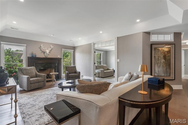 208 Ambridge Ct Unit 302, Chesterfield, MO 63017 - living room featuring wood finished floors, a glass covered fireplace, and recessed lighting