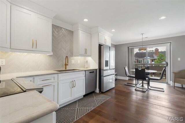 208 Ambridge Ct Unit 302, Chesterfield, MO 63017 - kitchen with appliances with stainless steel finishes, backsplash, white cabinets, dark wood-type flooring, and ornamental molding