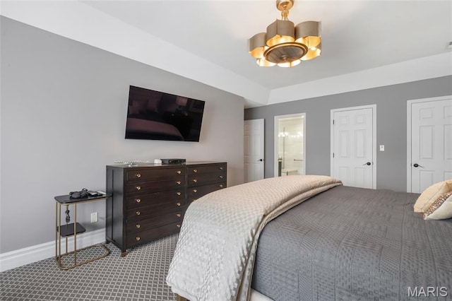 208 Ambridge Ct Unit 302, Chesterfield, MO 63017 - bedroom featuring a chandelier, carpet, a ceiling fan, and ensuite bath