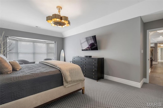 208 Ambridge Ct Unit 302, Chesterfield, MO 63017 - carpeted bedroom with baseboards and a chandelier