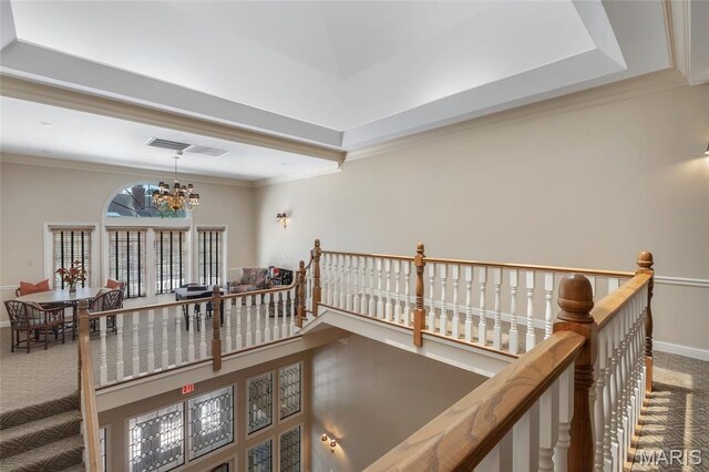 208 Ambridge Ct Unit 302, Chesterfield, MO 63017 - hallway featuring an upstairs landing, a chandelier, carpet floors, and ornamental molding