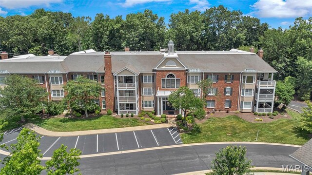 208 Ambridge Ct Unit 302, Chesterfield, MO 63017 - view of building exterior with uncovered parking