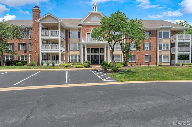 208 Ambridge Ct Unit 302, Chesterfield, MO 63017 - view of apartment building / complex with uncovered parking