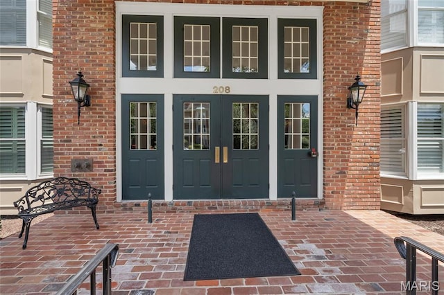 208 Ambridge Ct Unit 302, Chesterfield, MO 63017 - property entrance with french doors and brick siding