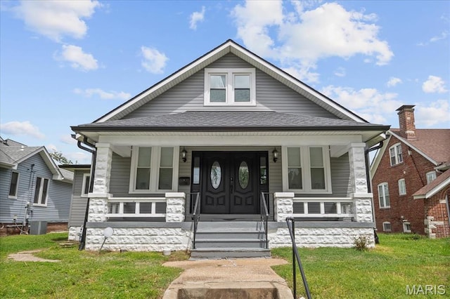 19 N 31st St N, Belleville, IL 62226 - view of front facade with a porch, a front lawn, and roof with shingles
