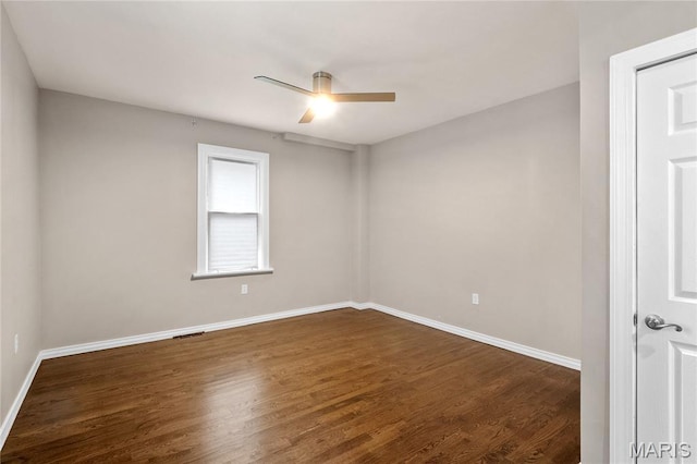 19 N 31st St N, Belleville, IL 62226 - spare room featuring ceiling fan and dark wood-type flooring