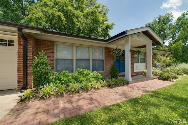 13011 Ambois Dr, Saint Louis, MO 63141 - doorway to property featuring brick siding and an attached garage