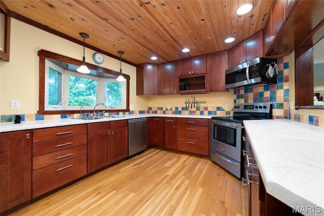 13011 Ambois Dr, Saint Louis, MO 63141 - kitchen featuring stainless steel appliances, light wood-style floors, light countertops, recessed lighting, and decorative light fixtures