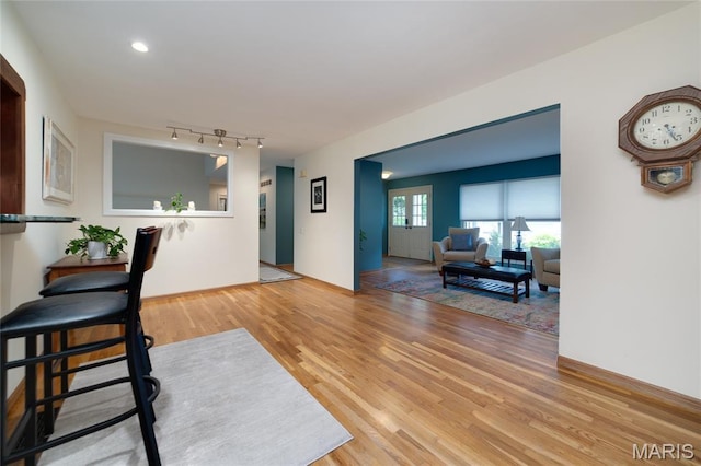 13011 Ambois Dr, Saint Louis, MO 63141 - living area with wood finished floors and rail lighting