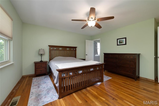 13011 Ambois Dr, Saint Louis, MO 63141 - bedroom with wood finished floors, multiple windows, and a ceiling fan