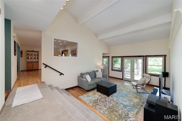 13011 Ambois Dr, Saint Louis, MO 63141 - living area with french doors, wood finished floors, beam ceiling, and high vaulted ceiling