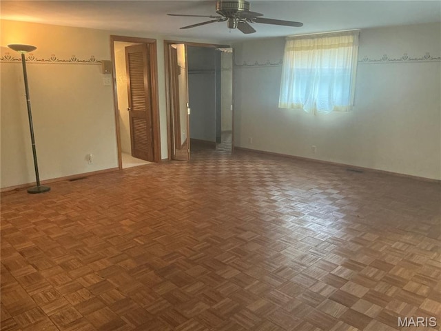 211 Edgar St, Gillespie, IL 62033 - unfurnished bedroom featuring a ceiling fan and multiple closets
