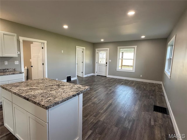 6596 County Road 263, Hannibal, MO 63401 - kitchen featuring dark wood-style floors, white cabinetry, recessed lighting, a center island, and dark stone countertops