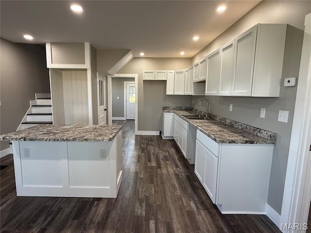 6596 County Road 263, Hannibal, MO 63401 - kitchen with dark wood-type flooring, recessed lighting, white cabinetry, dark stone countertops, and a kitchen island