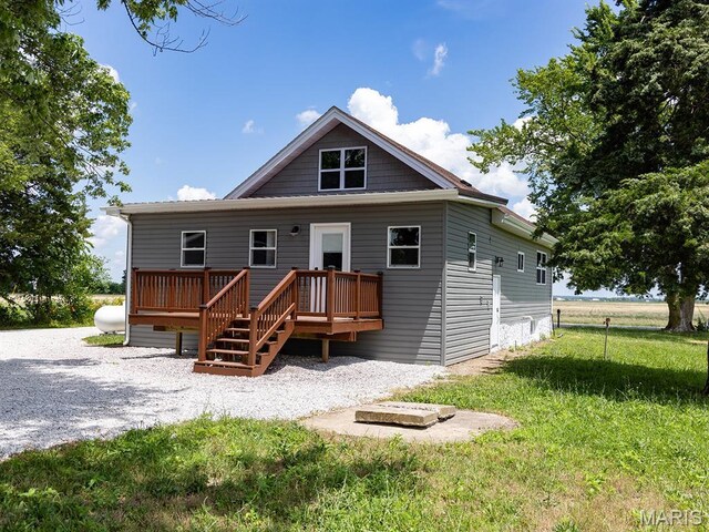 6596 County Road 263, Hannibal, MO 63401 - rear view of house featuring a wooden deck and a lawn